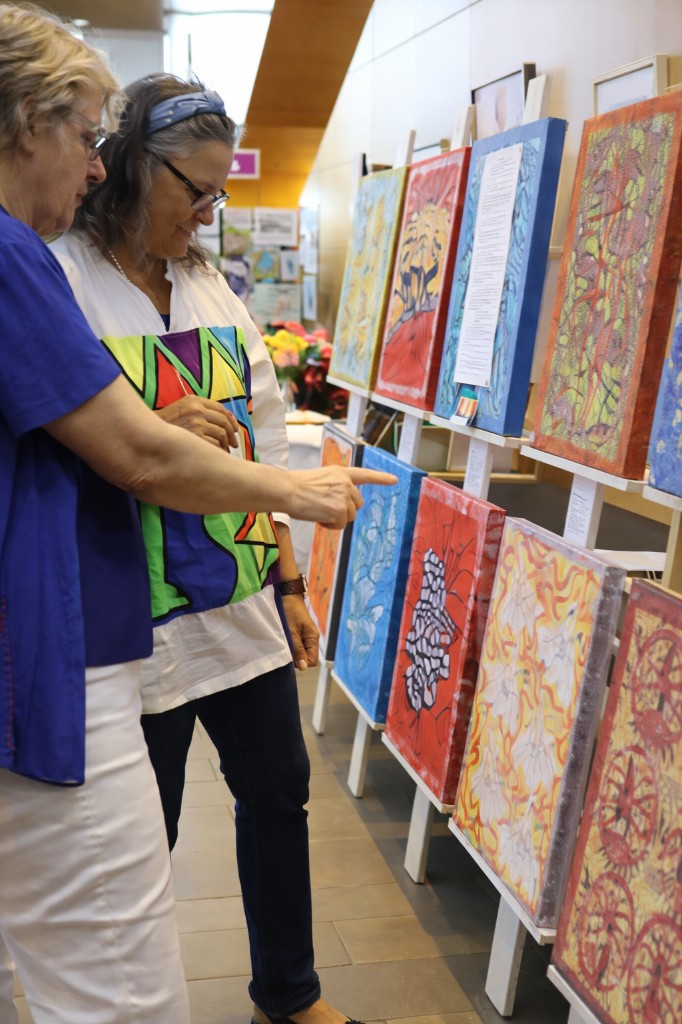 Visitors exploring art at a Richmond Hill cultural venue